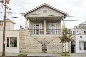 a house with a gate on the front of it at Sonder at Viewpoint in New Orleans