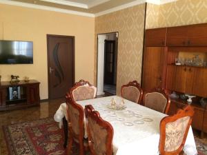 a dining room with a table and chairs at Gokor B&B in Dilijan