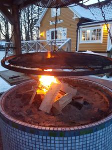 a fire pit in the middle of a yard at Furuliden Country Inn in Vittsjö