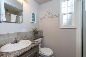a bathroom with a sink and a toilet at Live Oak Landing in Freeport +40 photos