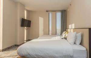 Voodi või voodid majutusasutuse The Parc Hotel toas
