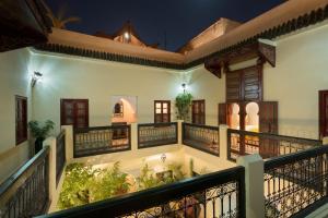 a view from the balcony of a house at night at Riad Julia in Marrakesh