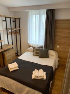 Posteľ alebo postele v izbe v ubytovaní hotel la trainera
