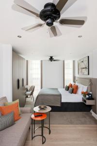 a bedroom with a bed and a ceiling fan at The Chronicle by Supercity Aparthotels in London