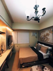 Voodi või voodid majutusasutuse Davao Boutique Condos - Avida toas