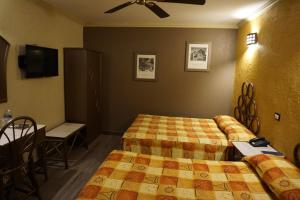 Katil atau katil-katil dalam bilik di Hotel Plaza Crystal