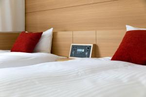 Postel nebo postele na pokoji v ubytování Nishitetsu Inn Nihonbashi