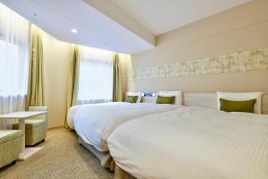 Katil atau katil-katil dalam bilik di Vessel Inn Chiba Station