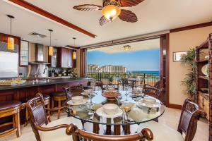 a dining room with a view of the ocean at Beach Villas at Ko Olina by Love Hawaii Villas in Kapolei