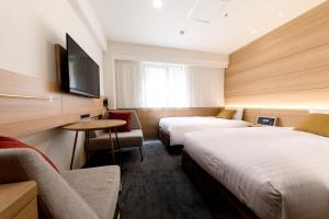 Postel nebo postele na pokoji v ubytování Nishitetsu Inn Nihonbashi + 37 fotografií