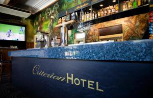 a bar at a hotel with a blue counter top at Criterion Hotel Gundagai in Gundagai +17 photos