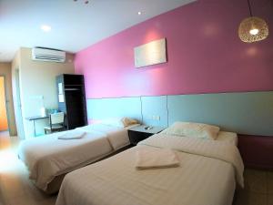 Postel nebo postele na pokoji v ubytování Hotel Jelai @ Temerloh, Pahang