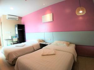 Postel nebo postele na pokoji v ubytování Hotel Jelai @ Temerloh, Pahang