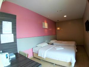 Postel nebo postele na pokoji v ubytování Hotel Jelai @ Temerloh, Pahang
