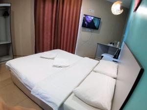 Postel nebo postele na pokoji v ubytování Hotel Jelai @ Temerloh, Pahang