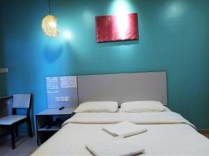 Postel nebo postele na pokoji v ubytování Hotel Jelai @ Temerloh, Pahang