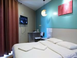 Postel nebo postele na pokoji v ubytování Hotel Jelai @ Temerloh, Pahang
