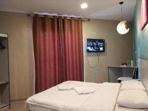 Postel nebo postele na pokoji v ubytování Hotel Jelai @ Temerloh, Pahang