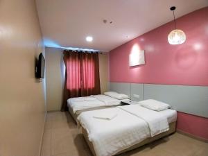 Postel nebo postele na pokoji v ubytování Hotel Jelai @ Temerloh, Pahang