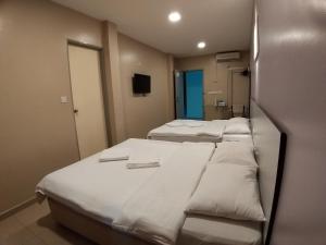 Postel nebo postele na pokoji v ubytování Hotel Jelai @ Temerloh, Pahang