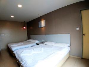 Postel nebo postele na pokoji v ubytování Hotel Jelai @ Temerloh, Pahang