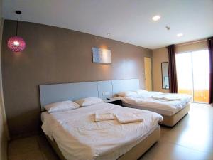 Postel nebo postele na pokoji v ubytování Hotel Jelai @ Temerloh, Pahang