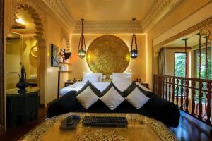 a bedroom with a bed with a keyboard on it at Sawasdee Village in Kata Beach