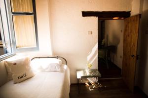Voodi või voodid majutusasutuse The Iskemleci Guest House toas