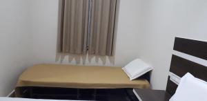 Postel nebo postele na pokoji v ubytování Mp Residency
