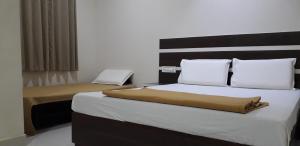 Postel nebo postele na pokoji v ubytování Mp Residency