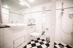 Ванна кімната в Comwell Hvide Hus Aalborg