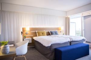 Ліжко або ліжка в номері Comwell Hvide Hus Aalborg