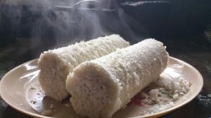 two pieces of cake on a white plate at Wild Mist Homestay in Munnar