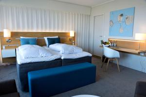 Ліжко або ліжка в номері Comwell Hvide Hus Aalborg