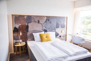 Ліжко або ліжка в номері Comwell Hvide Hus Aalborg