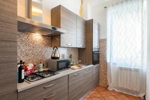 A kitchen or kitchenette at Veneto Prestige Apartment