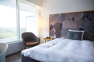 Ліжко або ліжка в номері Comwell Hvide Hus Aalborg