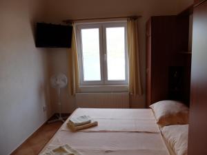Postel nebo postele na pokoji v ubytování Apartments Sunce