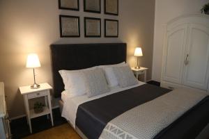 Uma cama ou camas num quarto em Palazzo Bignami