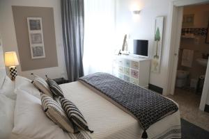 Uma cama ou camas num quarto em Palazzo Bignami
