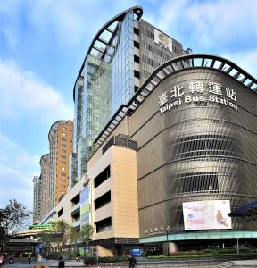 a building with a sign on the side of it at Master Hotel in Taipei