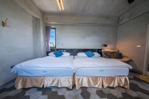 Ένα ή περισσότερα κρεβάτια σε δωμάτιο στο Mahalo B&B II