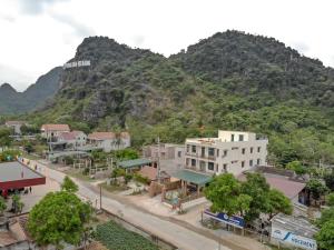 an overview of a town with mountains in the background at Phong Nha Love Homestay in Phong Nha
