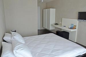Postel nebo postele na pokoji v ubytování Fletcher Hotel - Restaurant Elzenduin