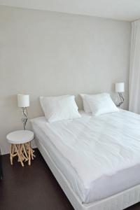 Giường trong phòng chung tại Fletcher Hotel - Restaurant Elzenduin