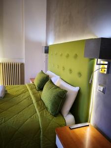Postel nebo postele na pokoji v ubytování Sant'Oronzo B&B