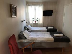 Postel nebo postele na pokoji v ubytování Skärplinge Gästis B&B