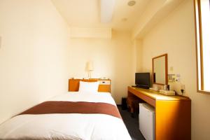 3s HOTEL HIRATSUKA客房内的一张或多张床位