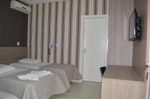 Uma cama ou camas num quarto em Star Hotel