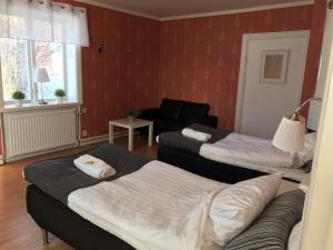 Postel nebo postele na pokoji v ubytování Skärplinge Gästis B&B